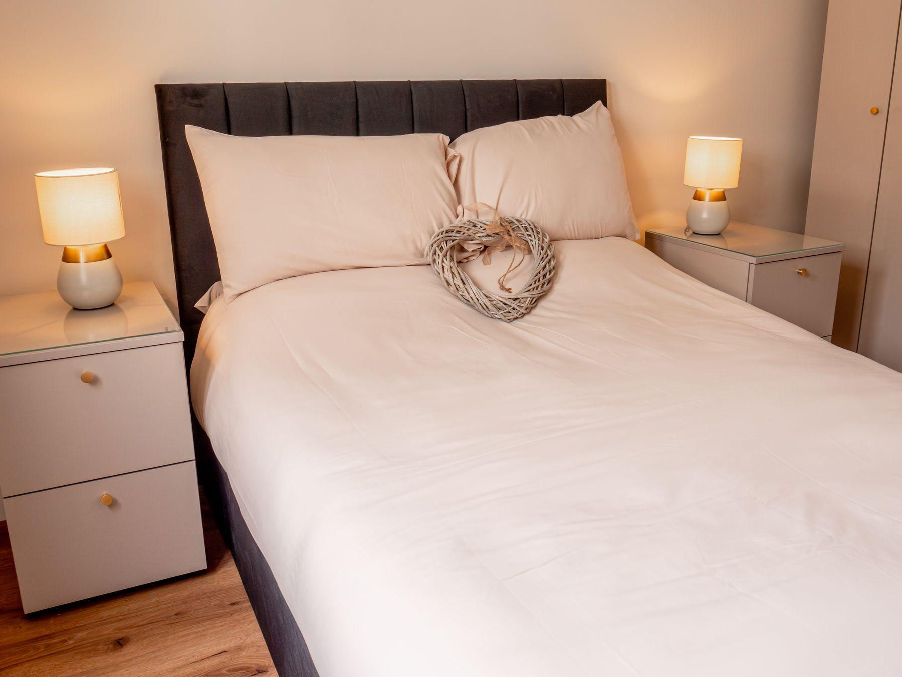 A lamp-lit bedroom